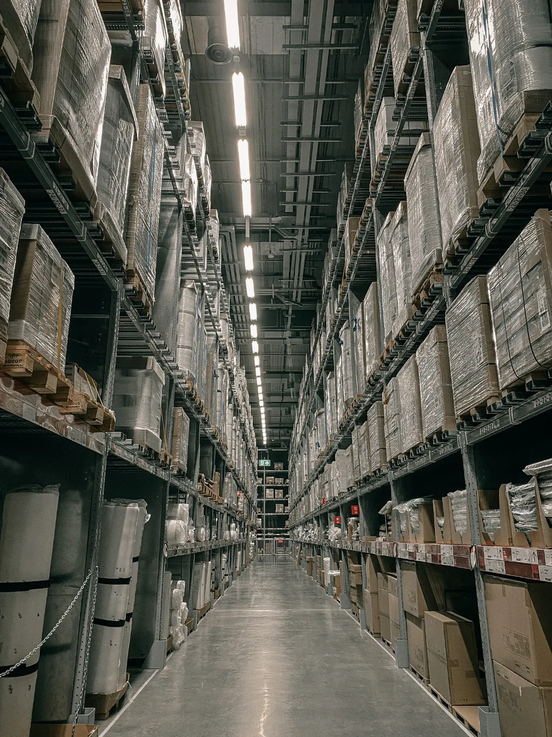 Warehouse aisle with high racking